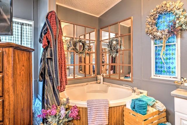 bathroom featuring a bath and a textured ceiling