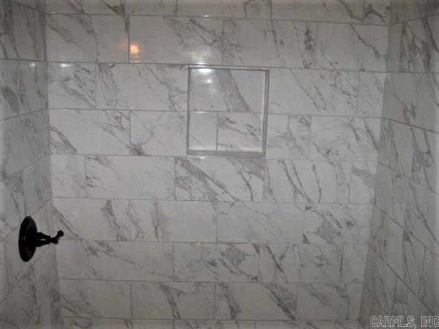details featuring a tile shower