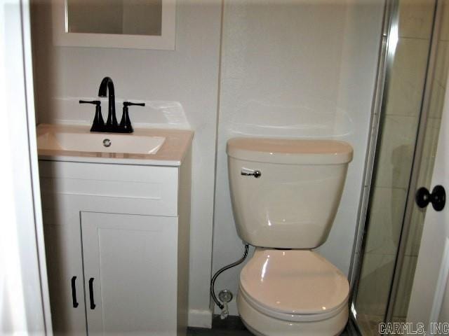 full bath with toilet and vanity