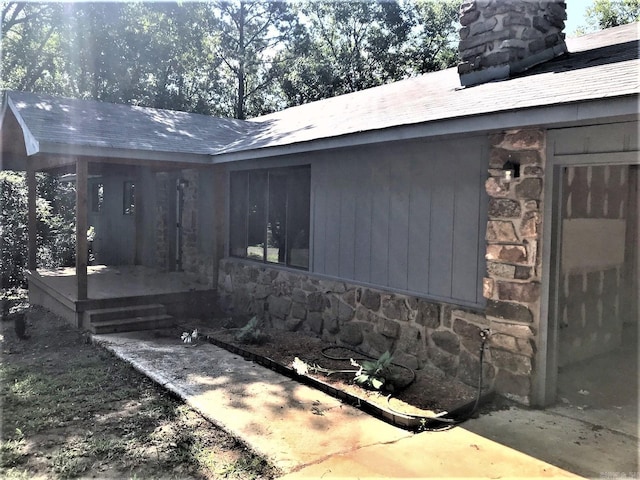 exterior space featuring stone siding