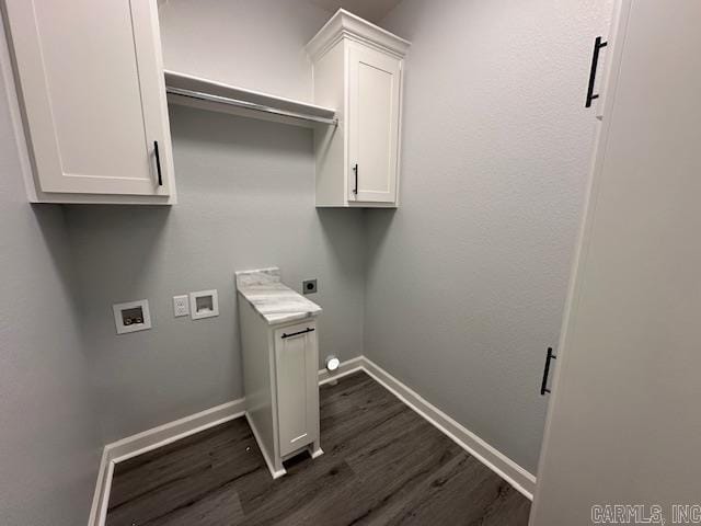 clothes washing area featuring baseboards, hookup for a washing machine, dark wood-style floors, cabinet space, and hookup for an electric dryer