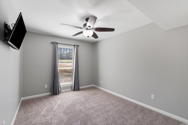 unfurnished room featuring baseboards, carpet, and ceiling fan