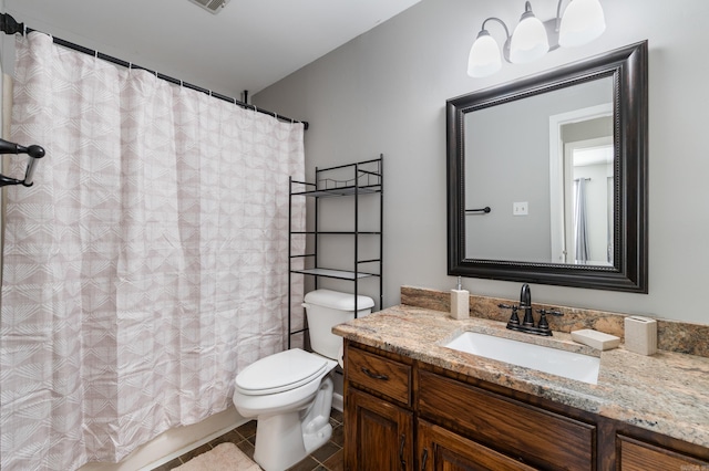 bathroom with vanity, tile patterned floors, toilet, and a shower with shower curtain
