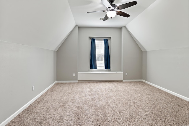 bonus room with carpet, a ceiling fan, and baseboards