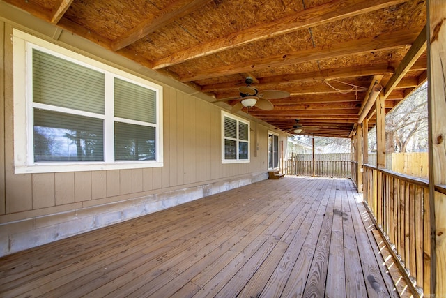 wooden terrace featuring a ceiling fan