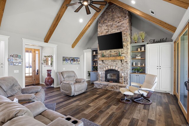 living room with visible vents, ceiling fan, beamed ceiling, a fireplace, and dark wood-style flooring