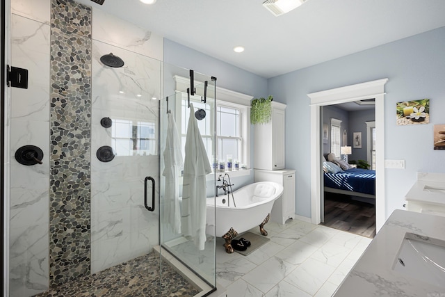 ensuite bathroom with visible vents, marble finish floor, ensuite bathroom, a marble finish shower, and a soaking tub