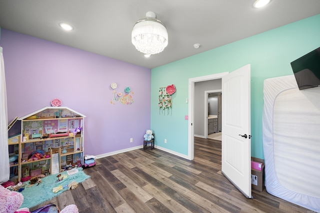 playroom featuring an inviting chandelier, recessed lighting, wood finished floors, and baseboards