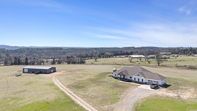 bird's eye view featuring a rural view and a wooded view
