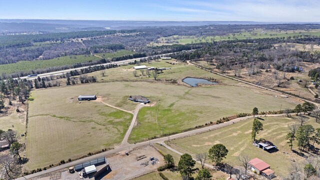 drone / aerial view with a water view and a rural view