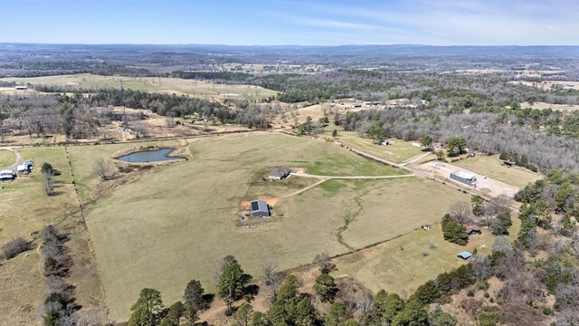 birds eye view of property with a water view and a rural view