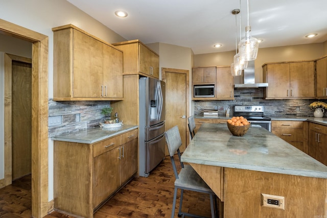 kitchen featuring wall chimney exhaust hood, light countertops, dark wood-style floors, stainless steel appliances, and backsplash