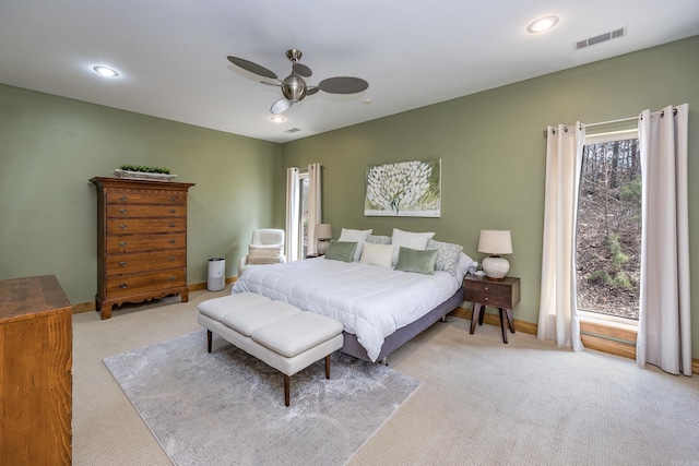 carpeted bedroom with recessed lighting, visible vents, baseboards, and ceiling fan