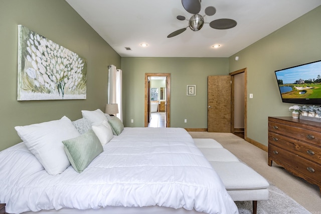 carpeted bedroom featuring visible vents, baseboards, and ceiling fan