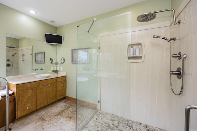 full bathroom featuring vanity and walk in shower