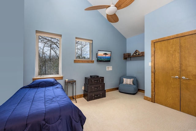 bedroom with high vaulted ceiling, baseboards, a ceiling fan, and carpet floors
