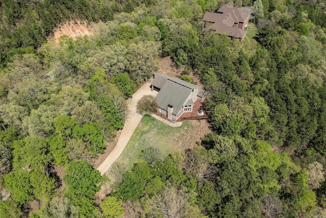 birds eye view of property with a forest view