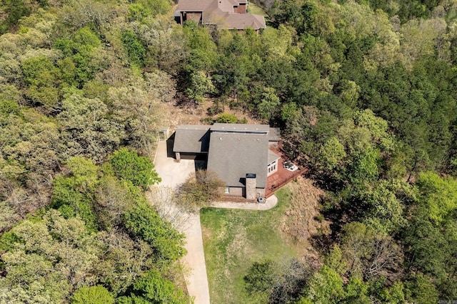 drone / aerial view featuring a forest view