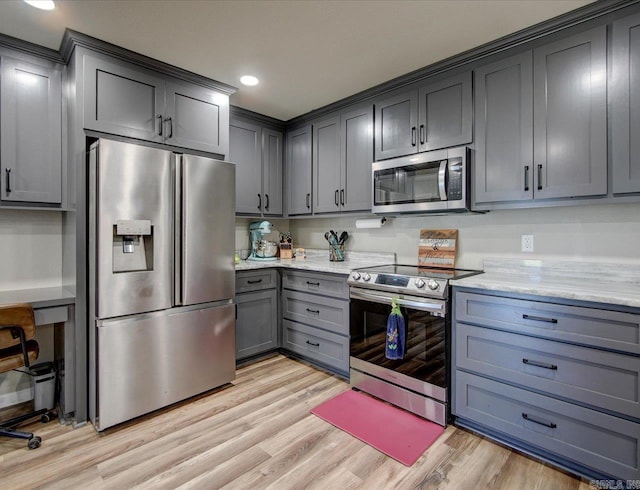 111 Westgate, Hot Springs, AR 71913 - kitchen with light wood-style flooring, recessed lighting, appliances with stainless steel finishes, light stone counters, and gray cabinets