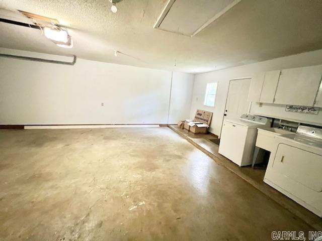 garage with washer and clothes dryer