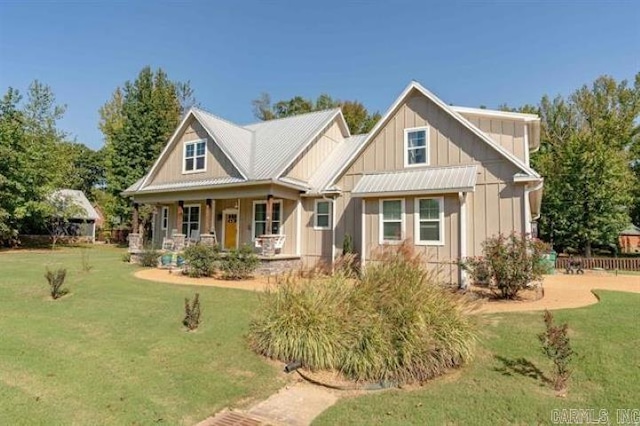 41 Rivers Edge Cv, Heber Springs, AR 72543 - craftsman-style home with a front lawn, metal roof, a porch, and board and batten siding