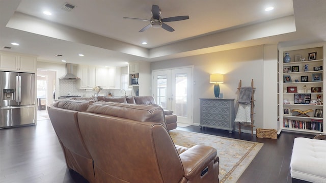 6006 Shadyside, Texarkana, TX 75503 - living room with a tray ceiling, wood finished floors, a ceiling fan, and plenty of natural light