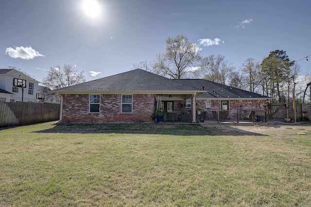 6006 Shadyside, Texarkana, TX 75503 - rear view of house with a yard, ceiling fan, brick siding, and fence private yard