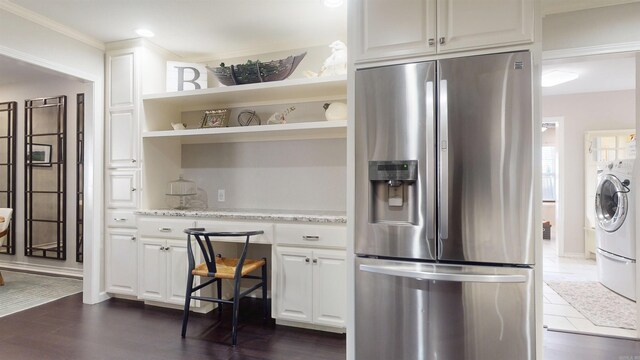 6006 Shadyside, Texarkana, TX 75503 - kitchen with stainless steel fridge, open shelves, dark wood-style flooring, white cabinets, and light stone countertops