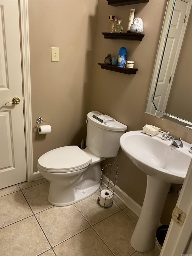 12706 Meadows Edge Ln, Little Rock, AR 72211 - bathroom with baseboards, toilet, and tile patterned flooring