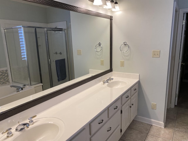 12706 Meadows Edge Ln, Little Rock, AR 72211 - bathroom featuring tile patterned floors, a sink, double vanity, and a shower stall