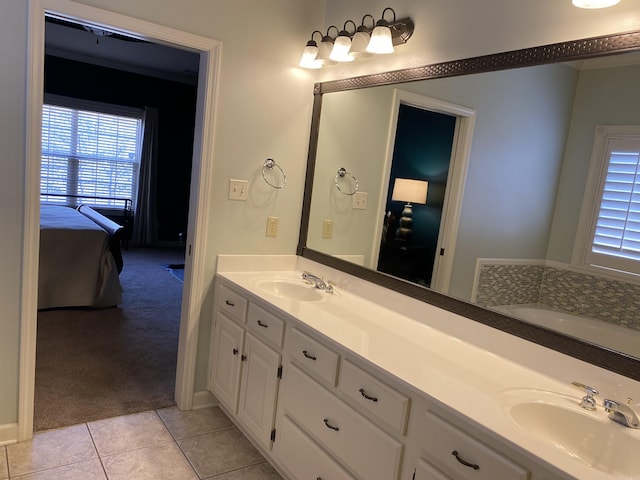 12706 Meadows Edge Ln, Little Rock, AR 72211 - bathroom featuring double vanity, a sink, tile patterned floors, and ensuite bath