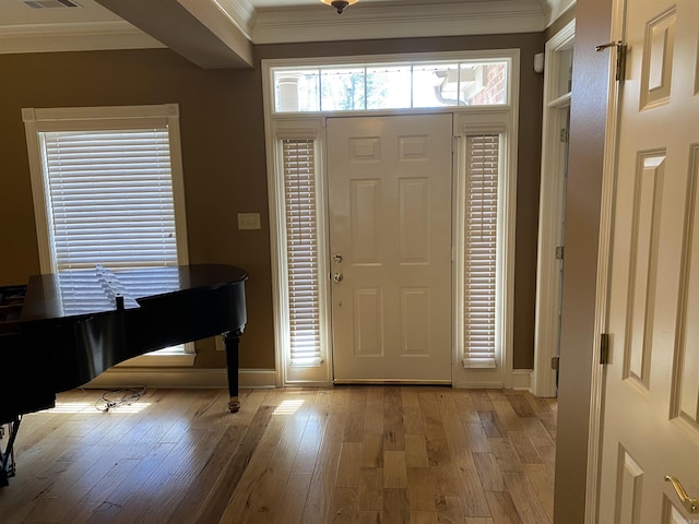 12706 Meadows Edge Ln, Little Rock, AR 72211 - foyer entrance with baseboards, visible vents, light wood-type flooring, and crown molding