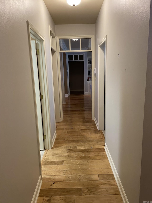 12706 Meadows Edge Ln, Little Rock, AR 72211 - corridor with light wood-style flooring and baseboards