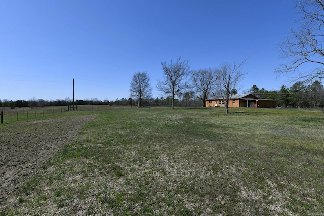 view of yard with a rural view