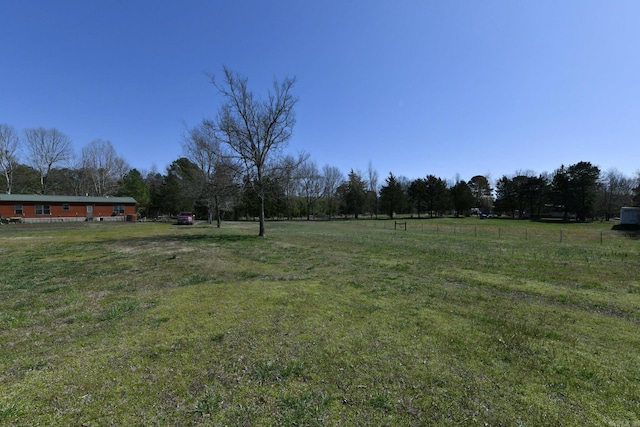 view of yard with a rural view