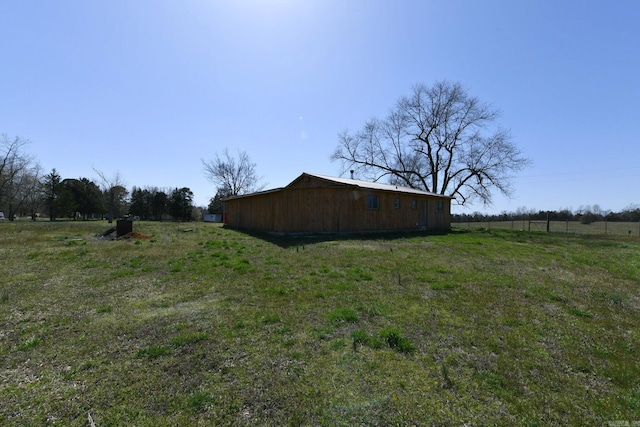 view of yard with a rural view