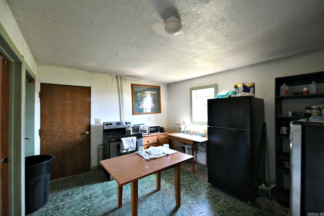 office with concrete floors, vaulted ceiling, and a textured ceiling