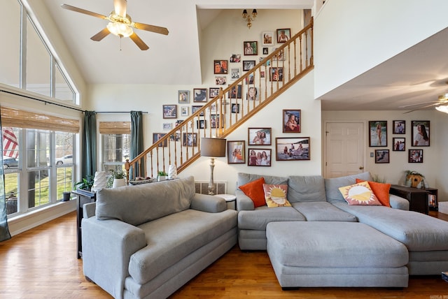 8 Allen Pt, Perryville, AR 72126 - living area featuring wood finished floors, a towering ceiling, stairway, and a ceiling fan