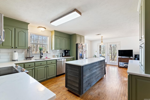 8 Allen Pt, Perryville, AR 72126 - kitchen with a sink, green cabinetry, and appliances with stainless steel finishes