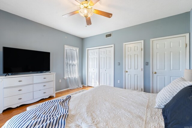 8 Allen Pt, Perryville, AR 72126 - bedroom with wood finished floors, baseboards, ceiling fan, and visible vents