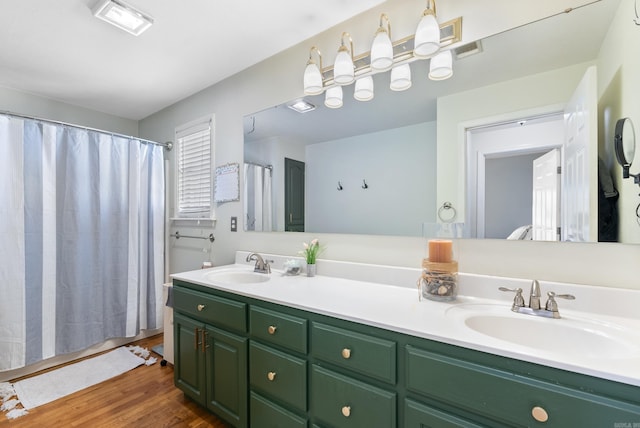 8 Allen Pt, Perryville, AR 72126 - full bath with double vanity, a sink, and wood finished floors