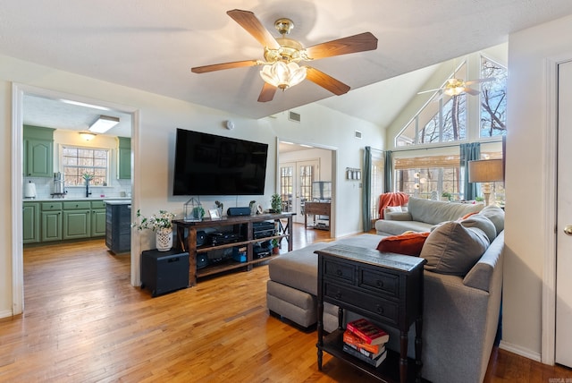 8 Allen Pt, Perryville, AR 72126 - living room with light wood-style flooring, visible vents, baseboards, ceiling fan, and lofted ceiling