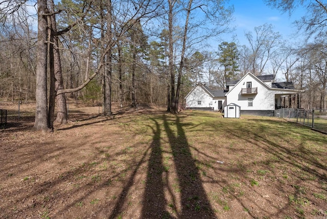 8 Allen Pt, Perryville, AR 72126 - view of yard featuring an outbuilding, a storage unit, and fence