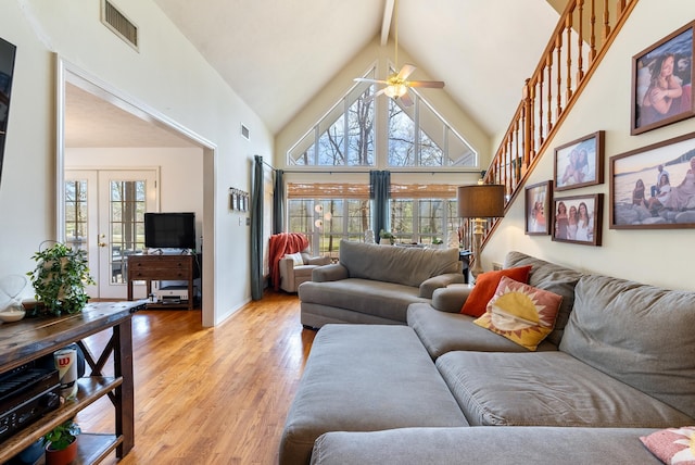 8 Allen Pt, Perryville, AR 72126 - living room featuring high vaulted ceiling, visible vents, a ceiling fan, and light wood-type flooring