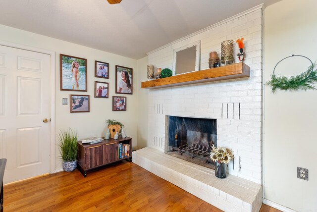 8 Allen Pt, Perryville, AR 72126 - living room with wood finished floors and a brick fireplace