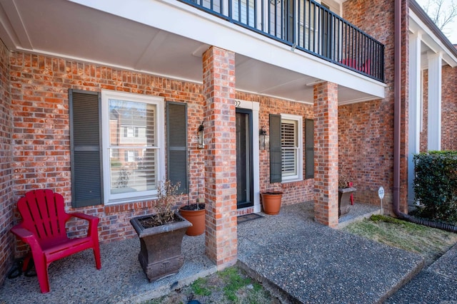view of patio with a balcony and a porch