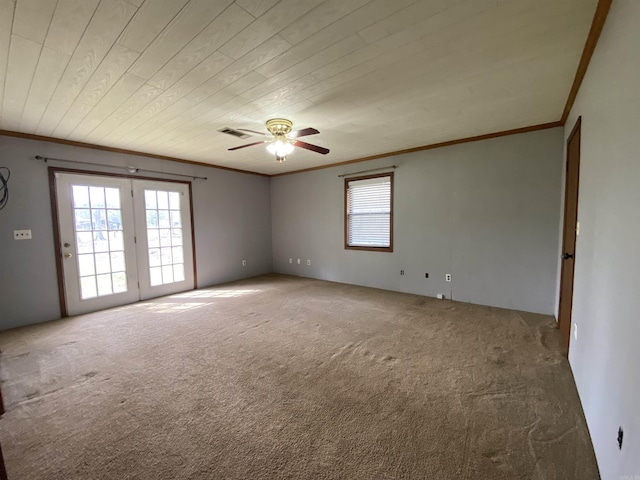 carpeted empty room with visible vents, wooden ceiling, ceiling fan, and ornamental molding