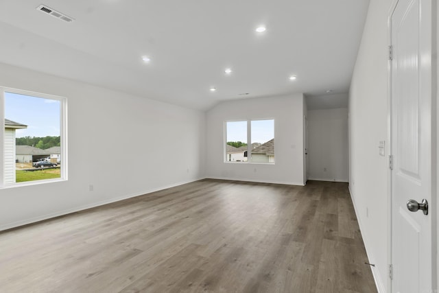 1233 Santa Fe Trl, Bauxite, AR 72011 - unfurnished room with wood finished floors, recessed lighting, baseboards, and vaulted ceiling