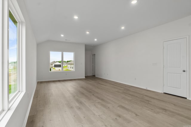 1233 Santa Fe Trl, Bauxite, AR 72011 - unfurnished room featuring plenty of natural light, light wood-style flooring, recessed lighting, baseboards, and vaulted ceiling