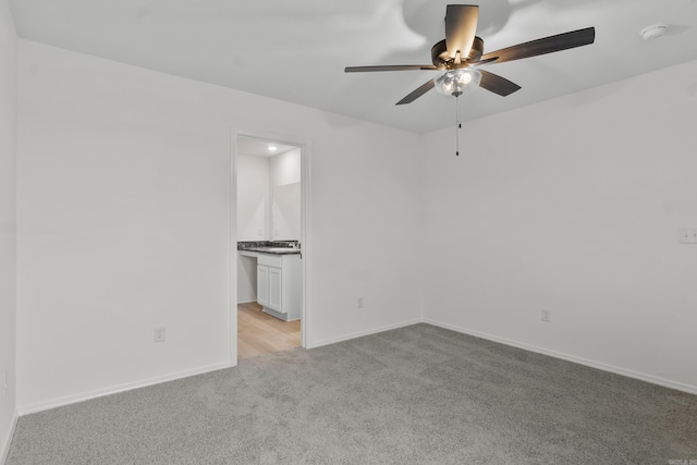 1233 Santa Fe Trl, Bauxite, AR 72011 - spare room with light carpet, a ceiling fan, a smoke detector, and baseboards